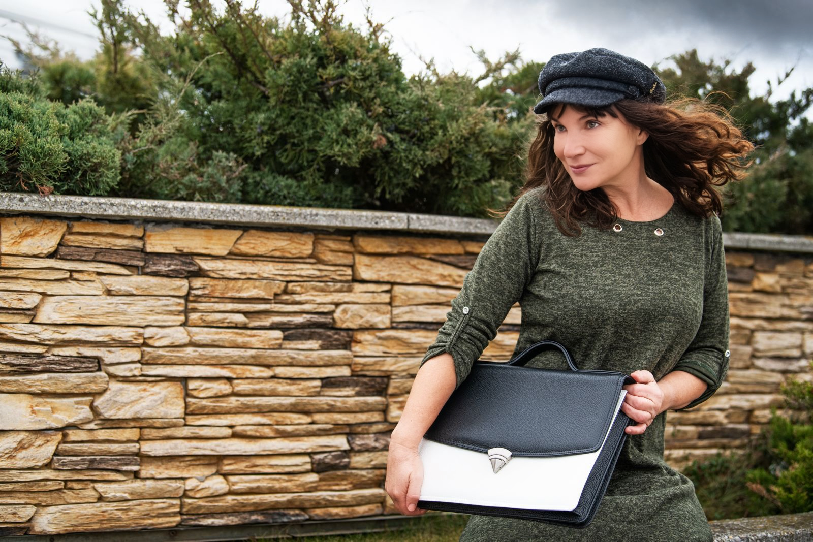 leather briefcase with a woman on the roof of a shopping mall