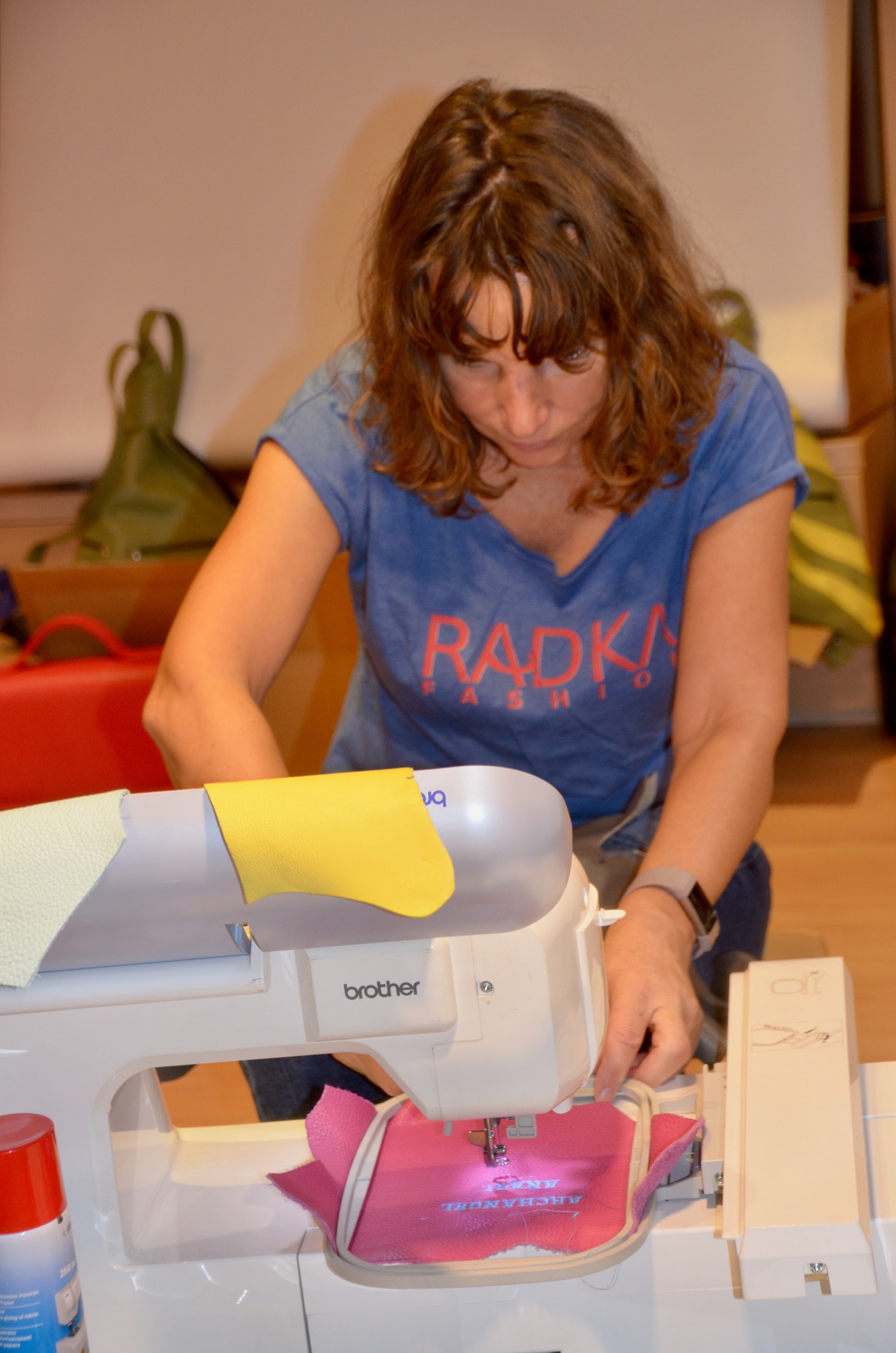 woman with a sewing machine at her atelier