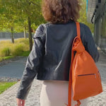 City Leather Backpack for women on shoulders of womasn