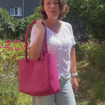 Leather tote bag wearing by woman outside in the city